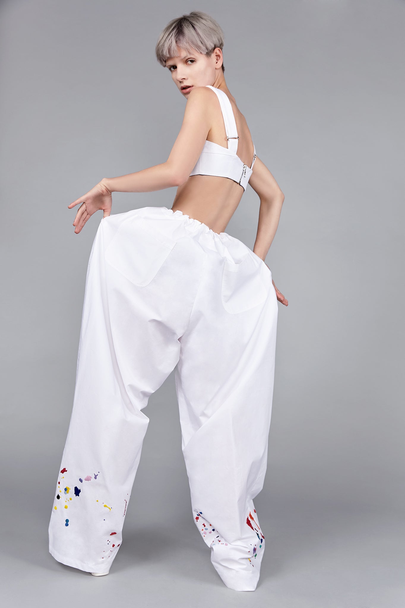 Colourful embroidered paint splashes on white cotton from emerging brand CIMONE. Our Burell trouser features a drawstring waistband and extremely wide leg for a relaxed fit - perfect dress up or dressed down.