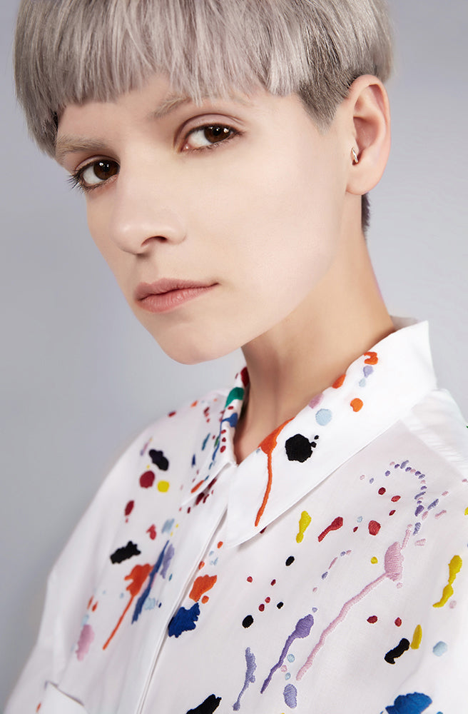 Colourful embroidered paint splashes on crisp white cotton 'cleave' shirt from emerging brand CIMONE. Embellishments and overall look at echoed by Oscar de la Renta one year later in SS18 - be ahead of the trends and support new brands!