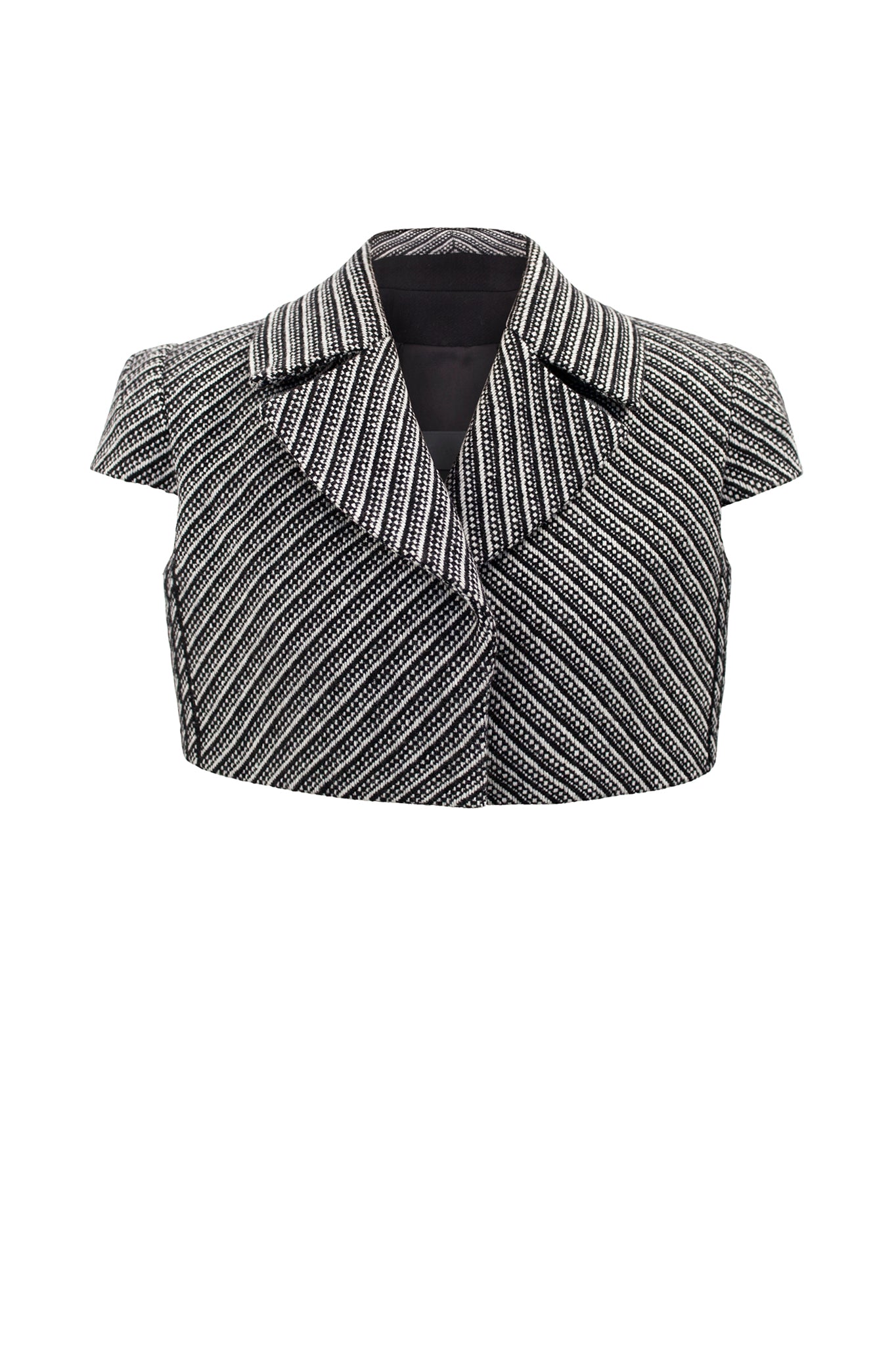 This cropped formal jacket, has a charming boyish boxy fit. The sleeve has a unique “stand away” construction for a sculptural shoulder. Worn on the catwalk. First seen on our AW17 (Fall Winter) catwalk during London Fashion Week.