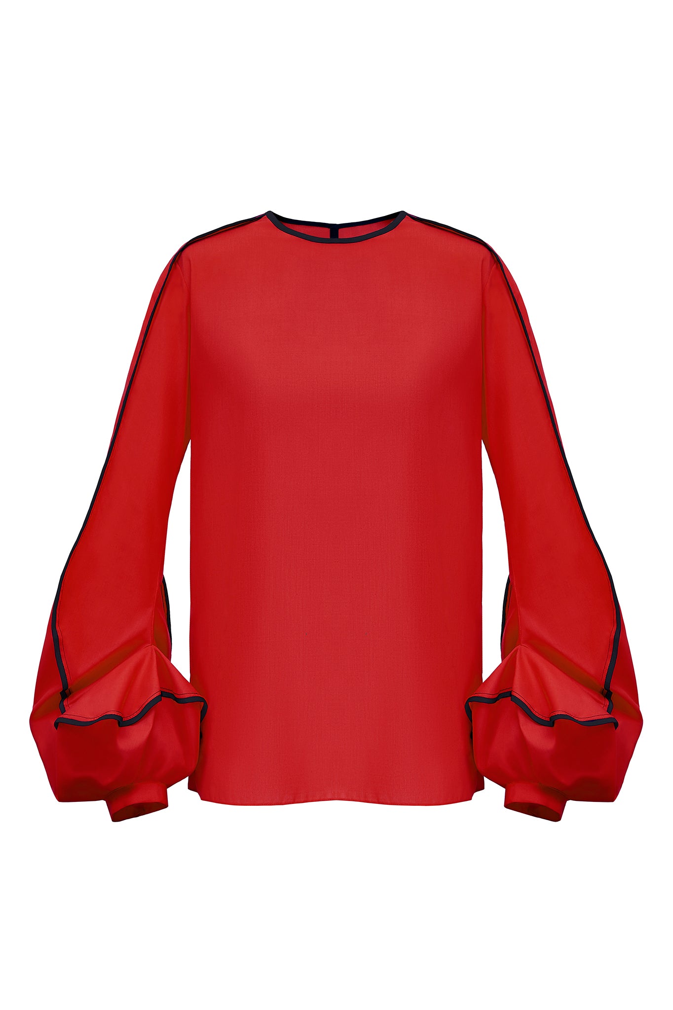 This blouse has the most unusual cuff detailing. Designed to emulate the swirl of the “Erupt” dress, the sleeve is bottom heavy and features two contrasting bound edges, highlighting the erratic movement of the seam work.  This piece has a simple straight, clean fit in the body, with a split seam in the back to open. Available on this page in either orange with navy blue binding, or red with black binding. Other colour ways are available (see links below)