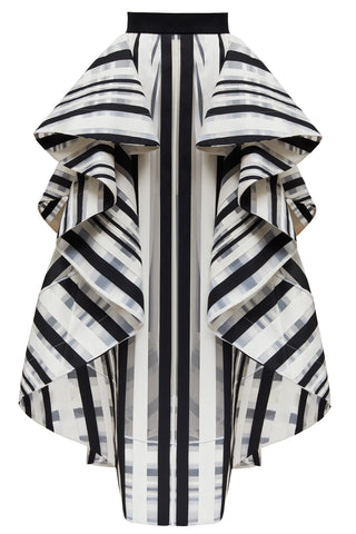 Our elegant day-to-night striped (in a lightweight technical fabric) “Shatter” skirt has free moving front and back panels. With a split side, these move independently casting an elegant shape and revealing a flash of underskirt or leg as the wearer walks. Shown as part of our AW17 catwalk collection.