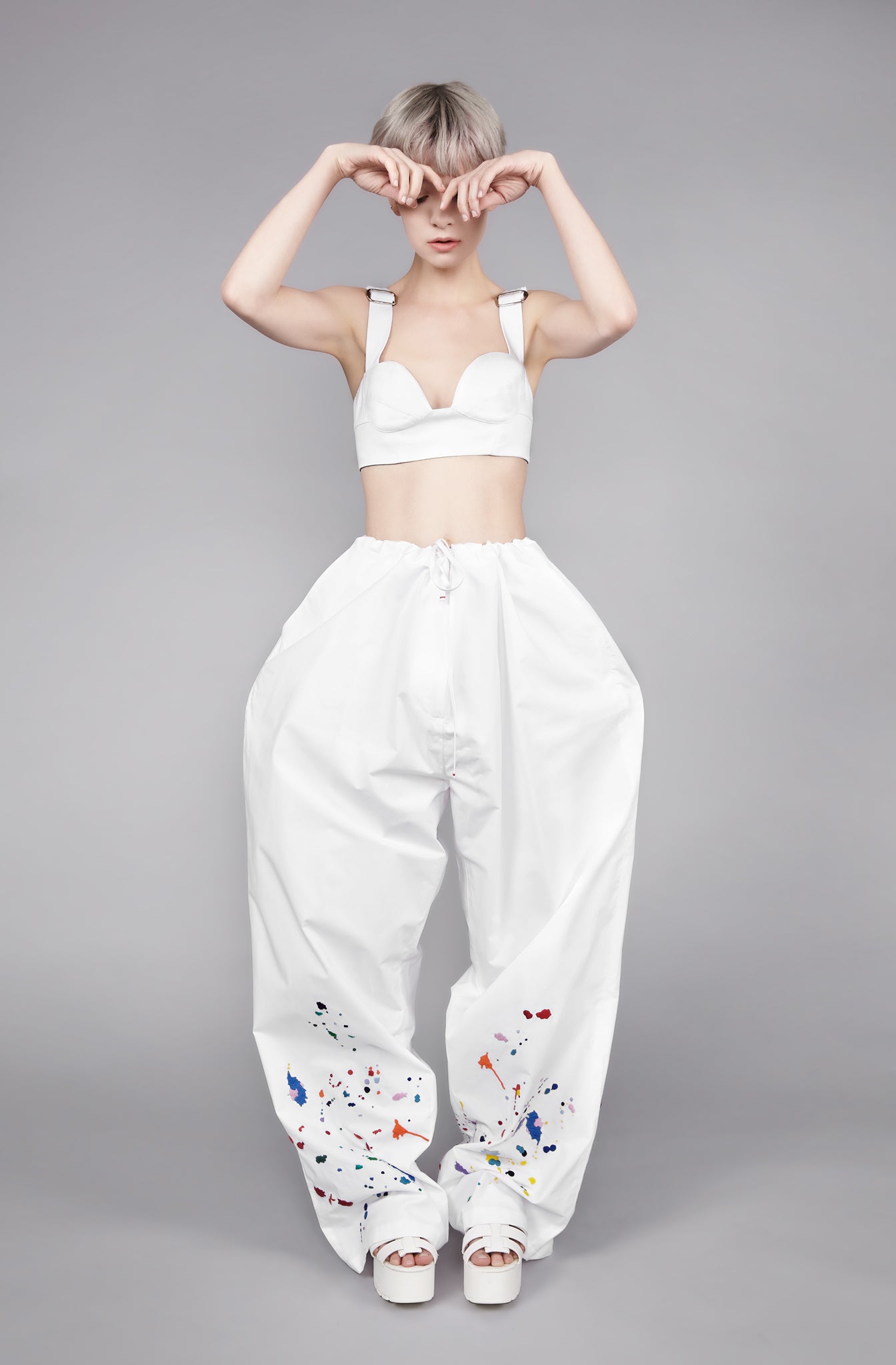 Colourful embroidered paint splashes on white cotton from emerging brand CIMONE. Our Burell trouser features a drawstring waistband and extremely wide leg for a relaxed fit - perfect dress up or dressed down.