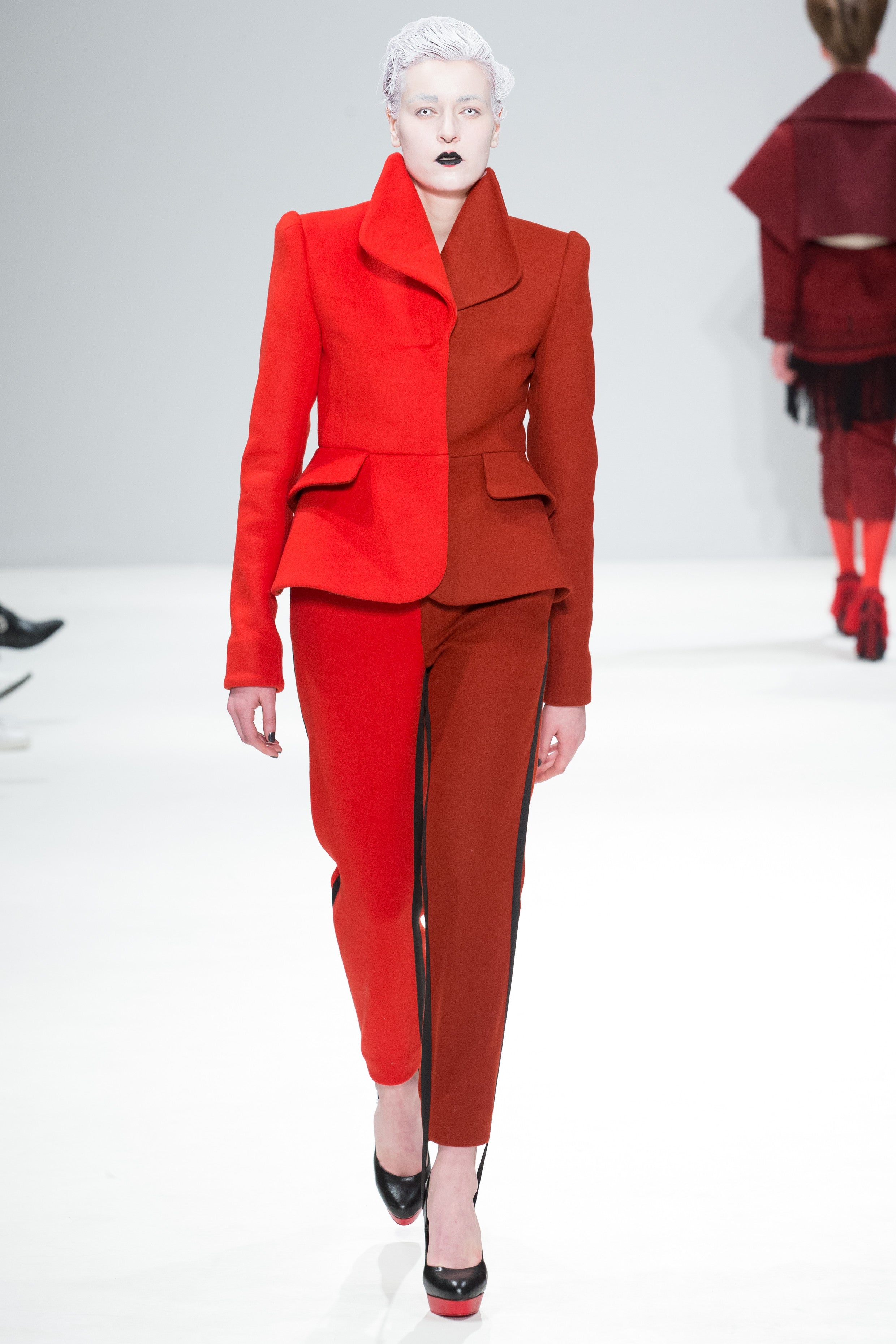 CIMONE's AW17 Dietrich jacket worn with the Pipe trouser on the fashion scout catwalk during London Fashion Week. Named after Marlene! This sculptural tailored and fitted suit jacket is fabricated in two-tone  red and burnt orange wool. 