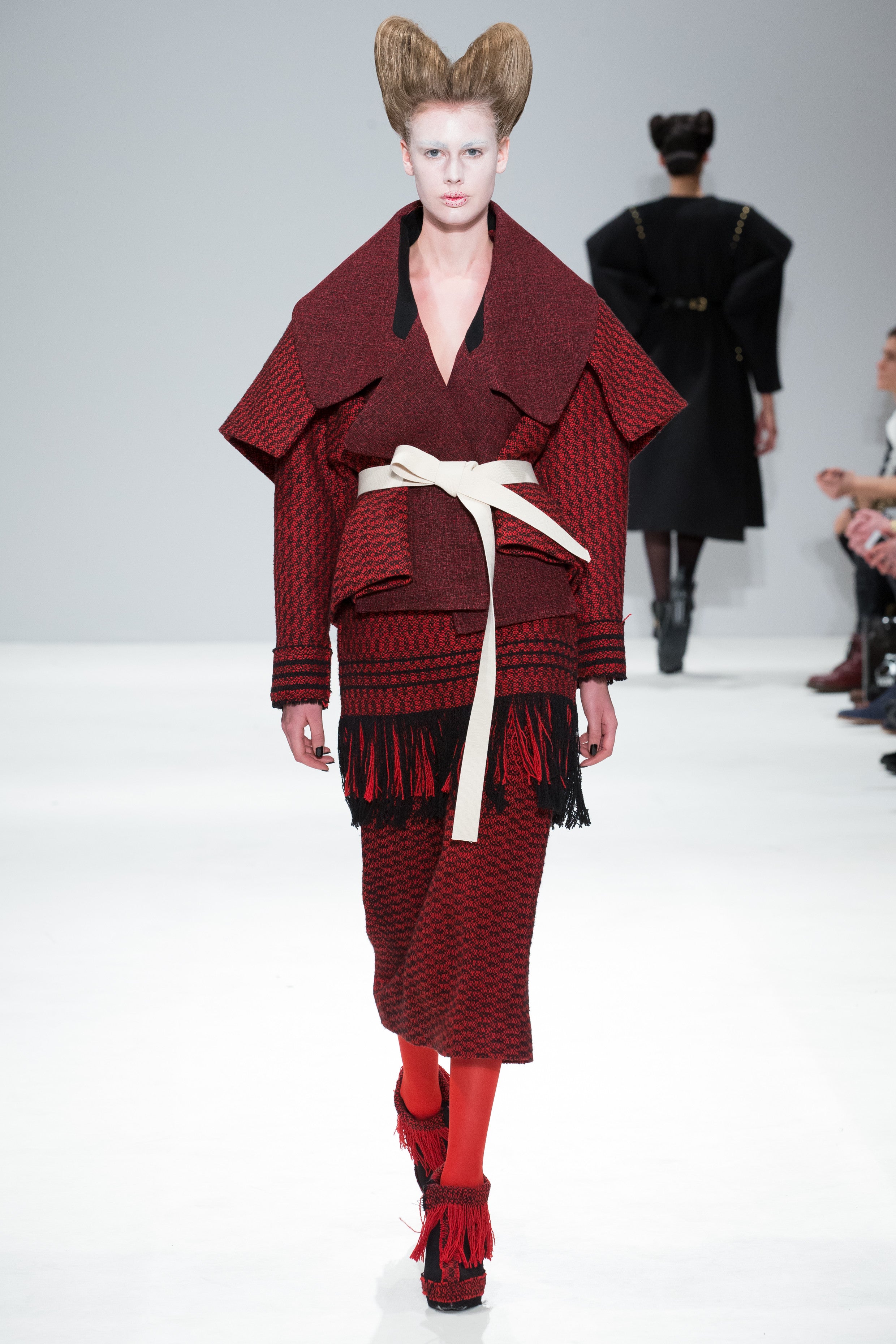 Red and Black armour jacket from the CIMONE AW17 catwalk show at London Fashion Week. Featuring a wide structured shoulder piece, resembling Japanese warrior armour styles.