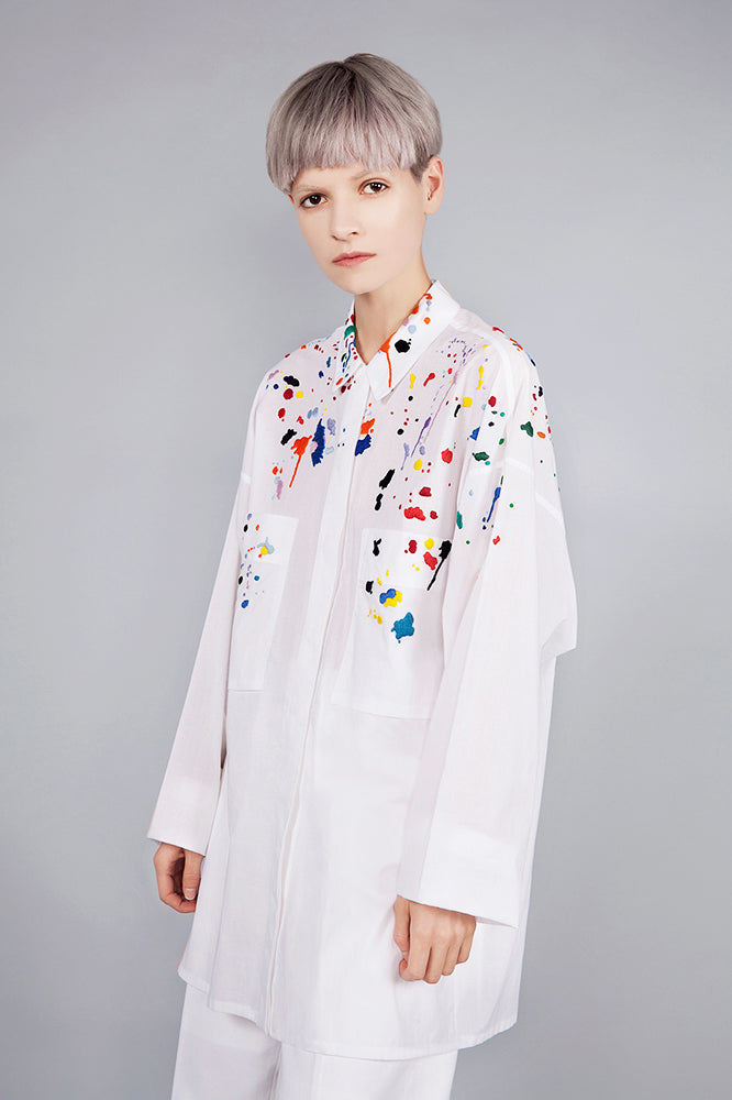 Colourful embroidered paint splashes on crisp white cotton 'cleave' shirt from emerging brand CIMONE. Embellishments and overall look at echoed by Oscar de la Renta one year later in SS18 - be ahead of the trends and support new brands!