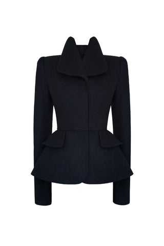 This sculptural suit jacket is fabricated in deep navy blue wool. It features a close fitting form for a structured silhouette, boasting a neat, tailored shoulder line. All of this is perfectly set off by a strong shoulder, achieved with our own hand-crafted shoulder pads, designed to be both comfortable and flattering.